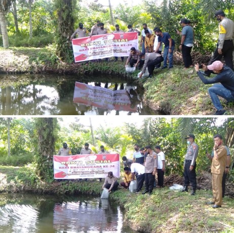  Jelang Hari Bhayangkara Ke-74, Polsek Tapung Berikan 10 Ribu Bibit Ikan di Desa Sei Lambu Makmur