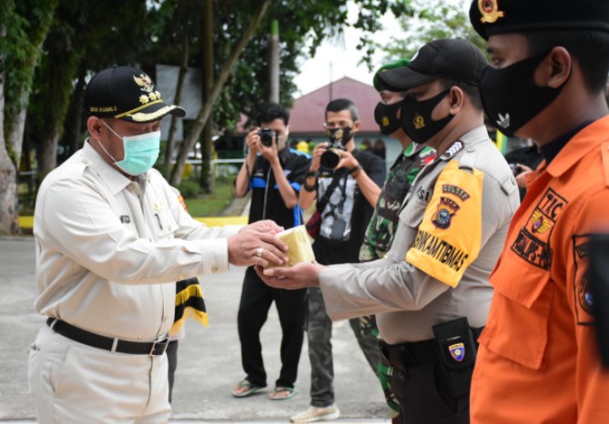  Launching Pembagian dan Pemakaian Masker Serentak, Bupati Kampar Ajak Patuhi Protokol Kesehatan