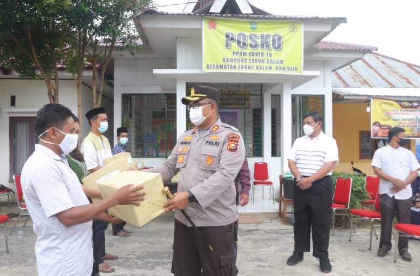  Kapolres Siak dan Bupati Berikan Bantuan Masker, Obat-Obatan dan Sembako