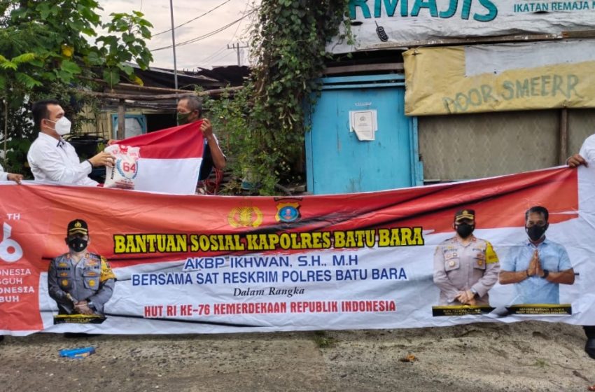 Sat Reskrim Bagikan Bansos Kapolres Batubara dan Bendera Indonesia di Desa Tanah Merah