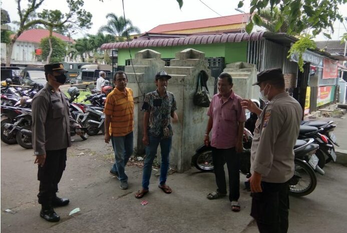  Polrestabes Medan Ajak Warga di Jalan Adinegoro Patuhi Prokes