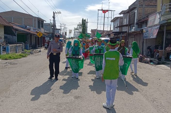 Polsek Medang Deras Kawal Pawai Keliling Hut Al Jam’iyatul Washliyah Ke-93